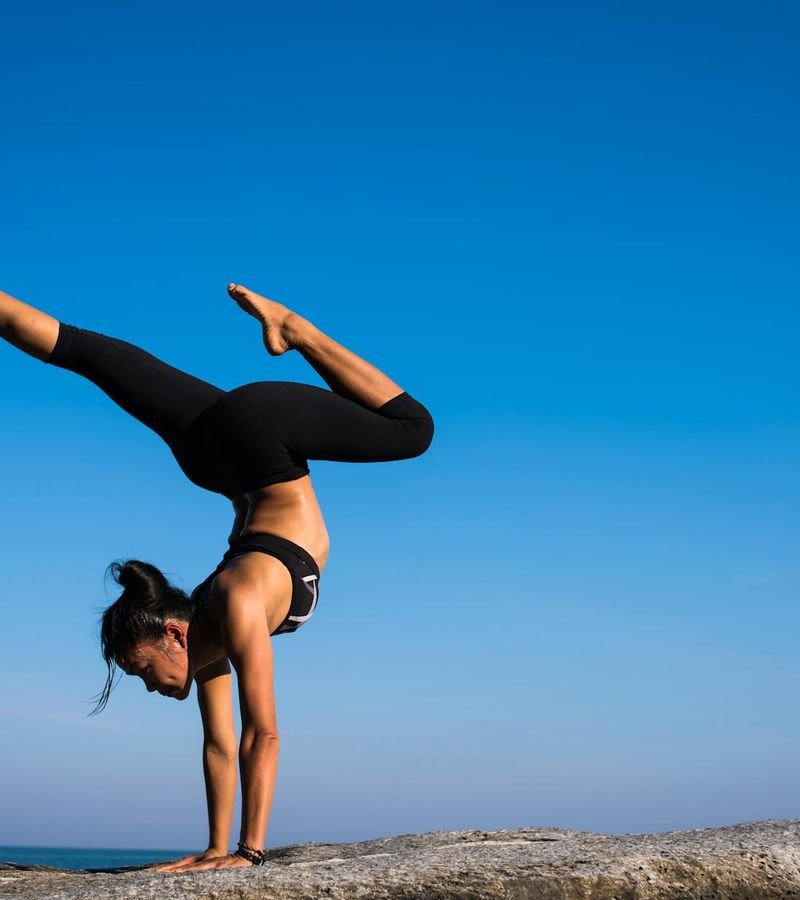 Person demonstrating flexibility and strength in a yoga pose.